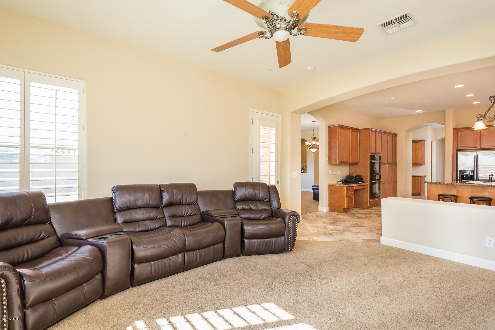 18169 West Narramore Road Goodyear, AZ 85338 - Photo 4 of 43 04- FAMILY ROOM TO KITCHEN