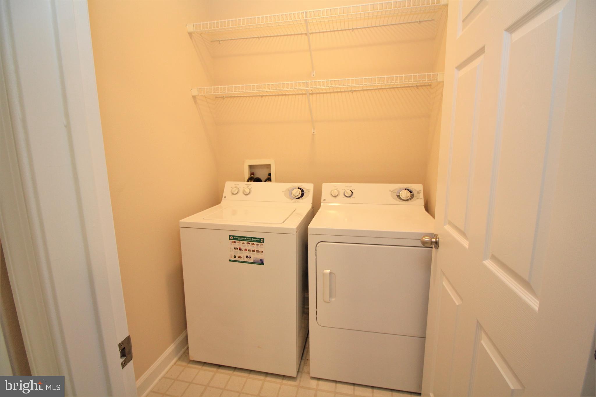 501 Hungerford Drive, Unit 137 Rockville, MD 20850 - Photo 11 of 37 a utility room with dryer and washer