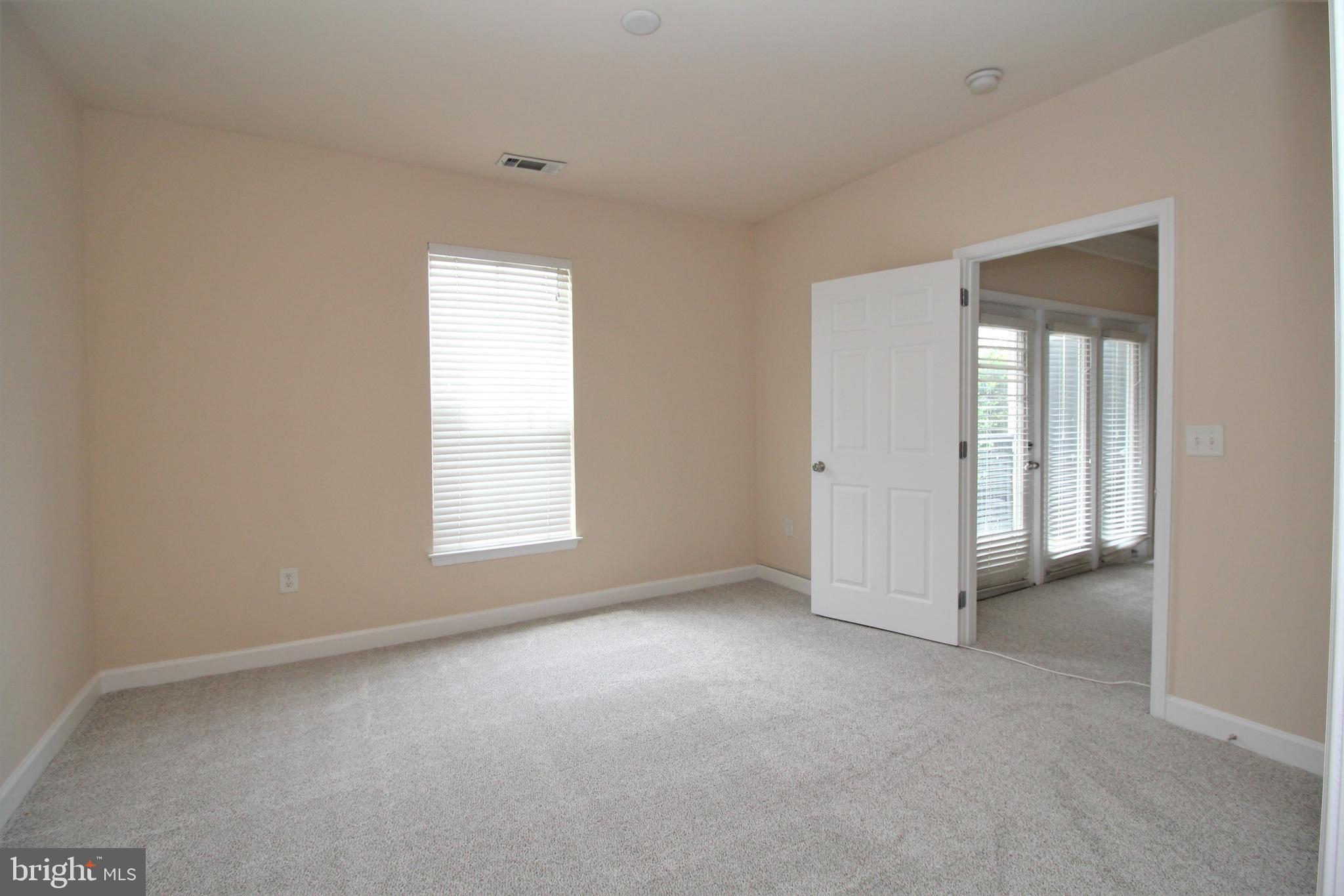 501 Hungerford Drive, Unit 137 Rockville, MD 20850 - Photo 15 of 37 a view of empty room with window