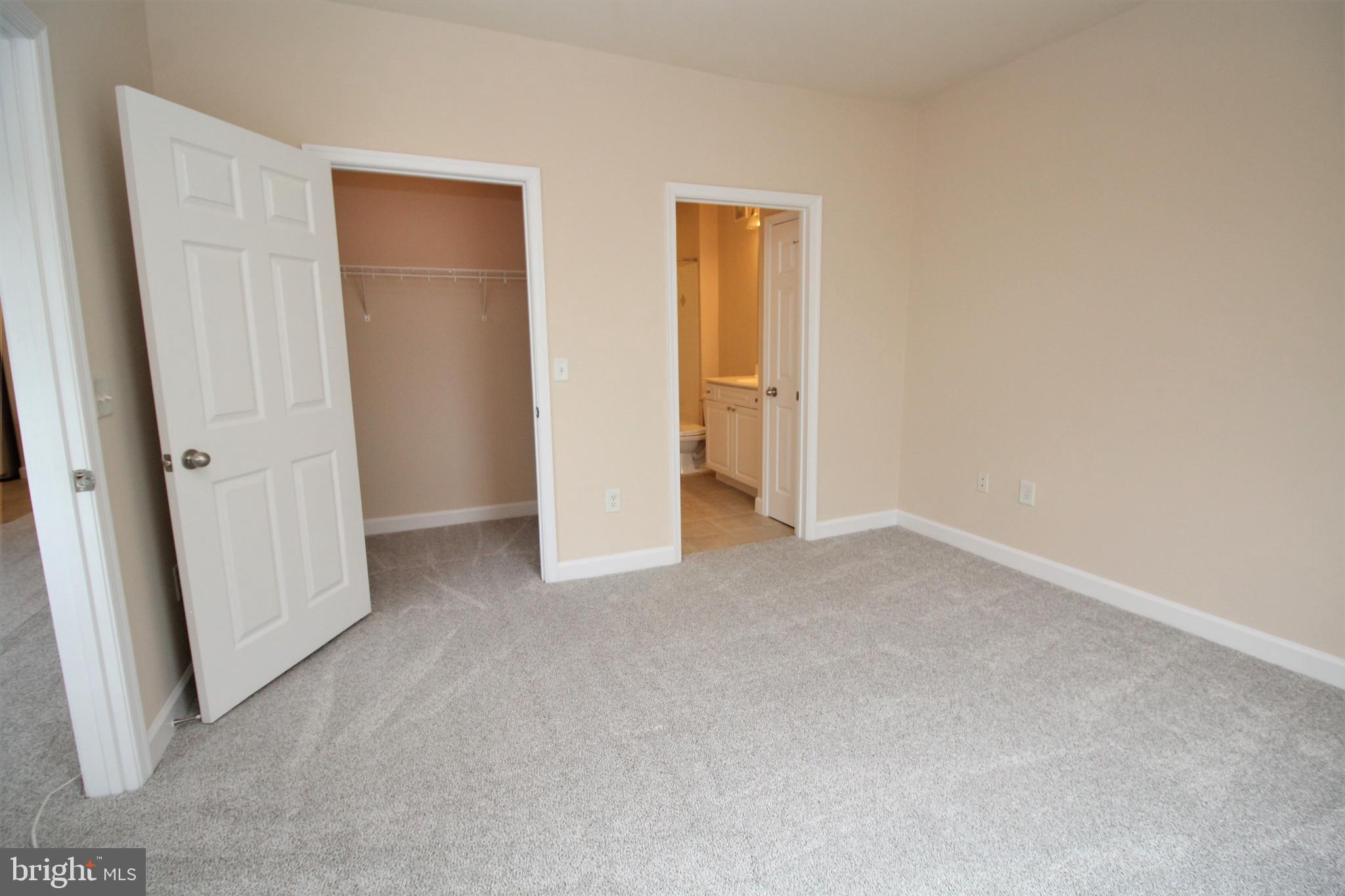 501 Hungerford Drive, Unit 137 Rockville, MD 20850 - Photo 18 of 37 an empty room with closet