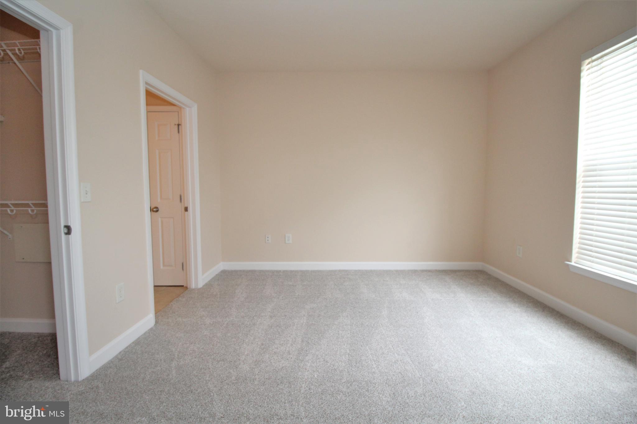 501 Hungerford Drive, Unit 137 Rockville, MD 20850 - Photo 20 of 37 an empty room with a window