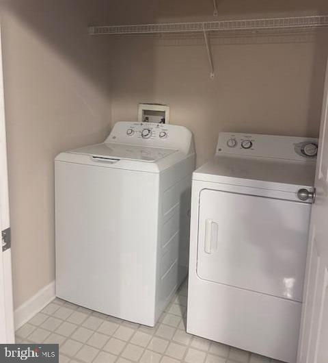 501 Hungerford Drive, Unit 137 Rockville, MD 20850 - Photo 22 of 37 a utility room with dryer and washer
