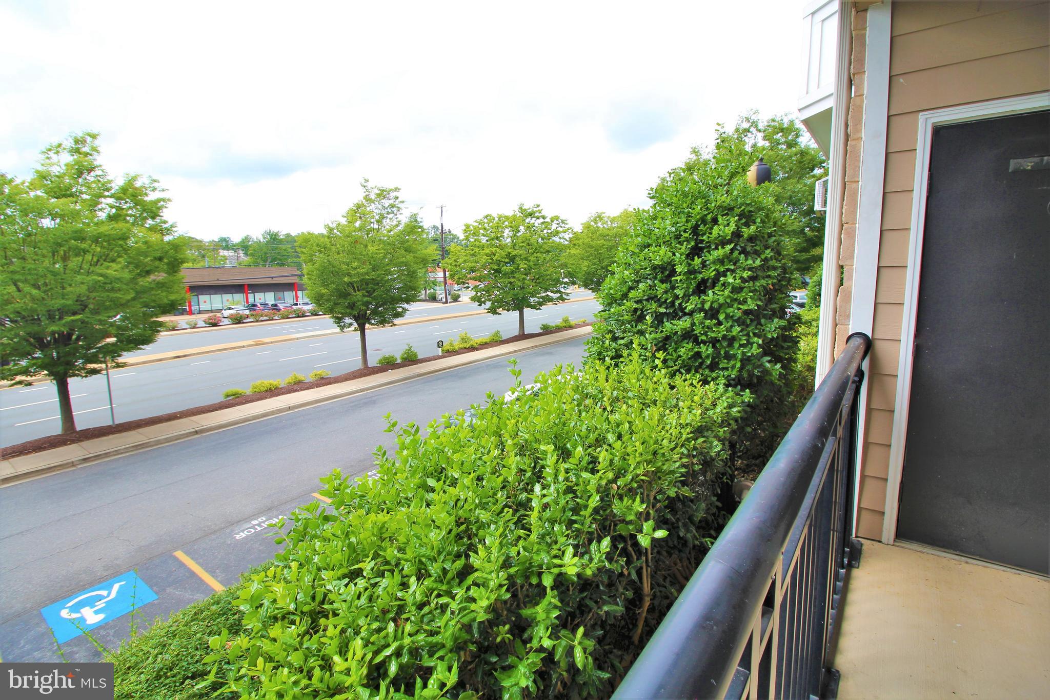 501 Hungerford Drive, Unit 137 Rockville, MD 20850 - Photo 26 of 37 a view of a balcony with an outdoor seating