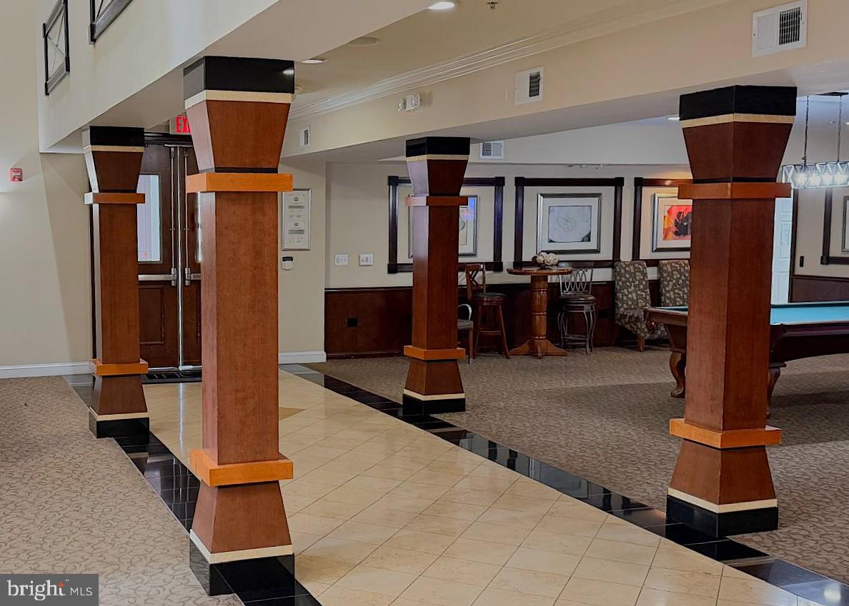 501 Hungerford Drive, Unit 137 Rockville, MD 20850 - Photo 29 of 37 a room with gym equipment