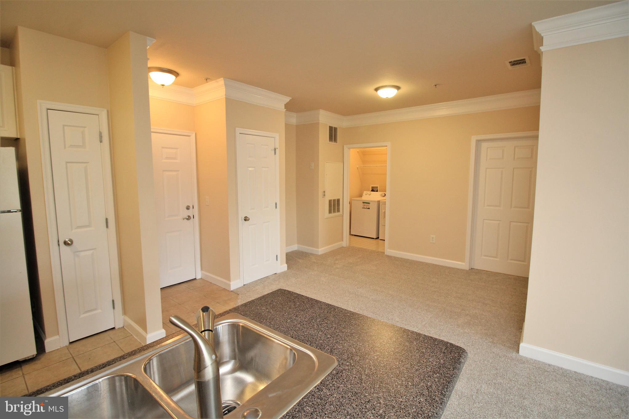 501 Hungerford Drive, Unit 137 Rockville, MD 20850 - Photo 5 of 37 a view of a livingroom with furniture