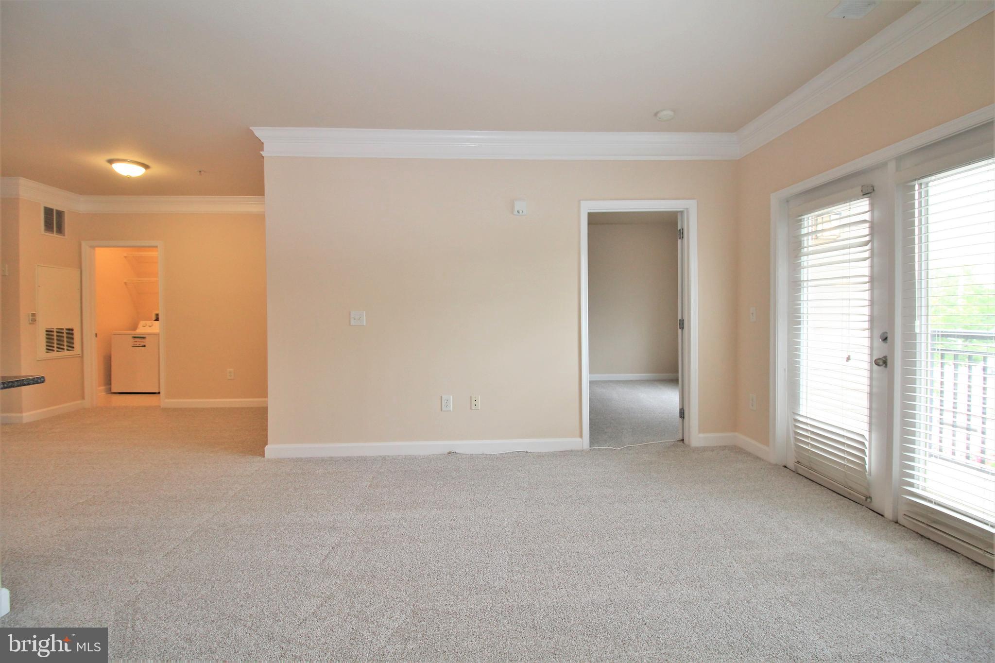 501 Hungerford Drive, Unit 137 Rockville, MD 20850 - Photo 9 of 37 a view of an empty room with a window