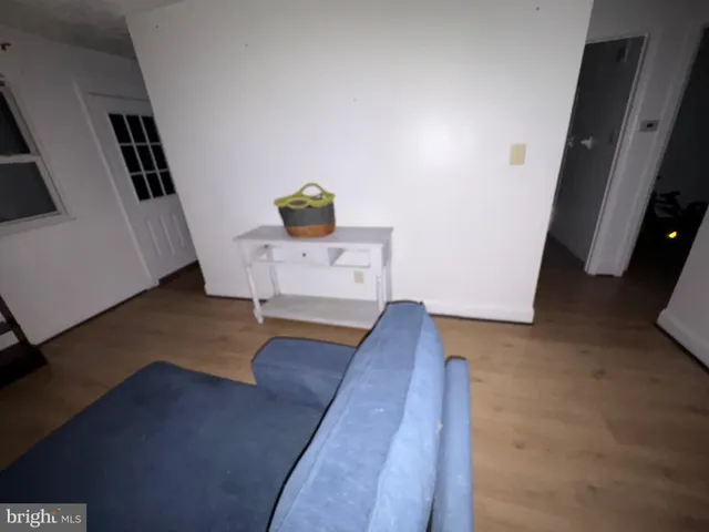 a view of living room with furniture and flat screen tv