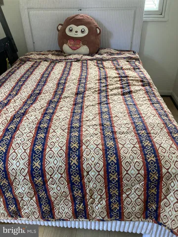 a bedroom with a bed and a table