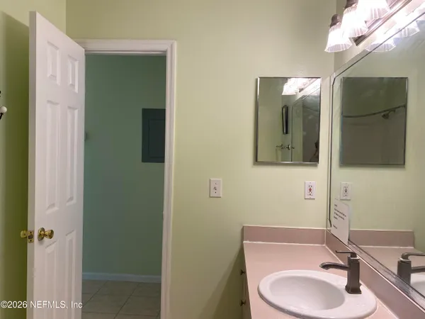 a bathroom with a sink and a mirror