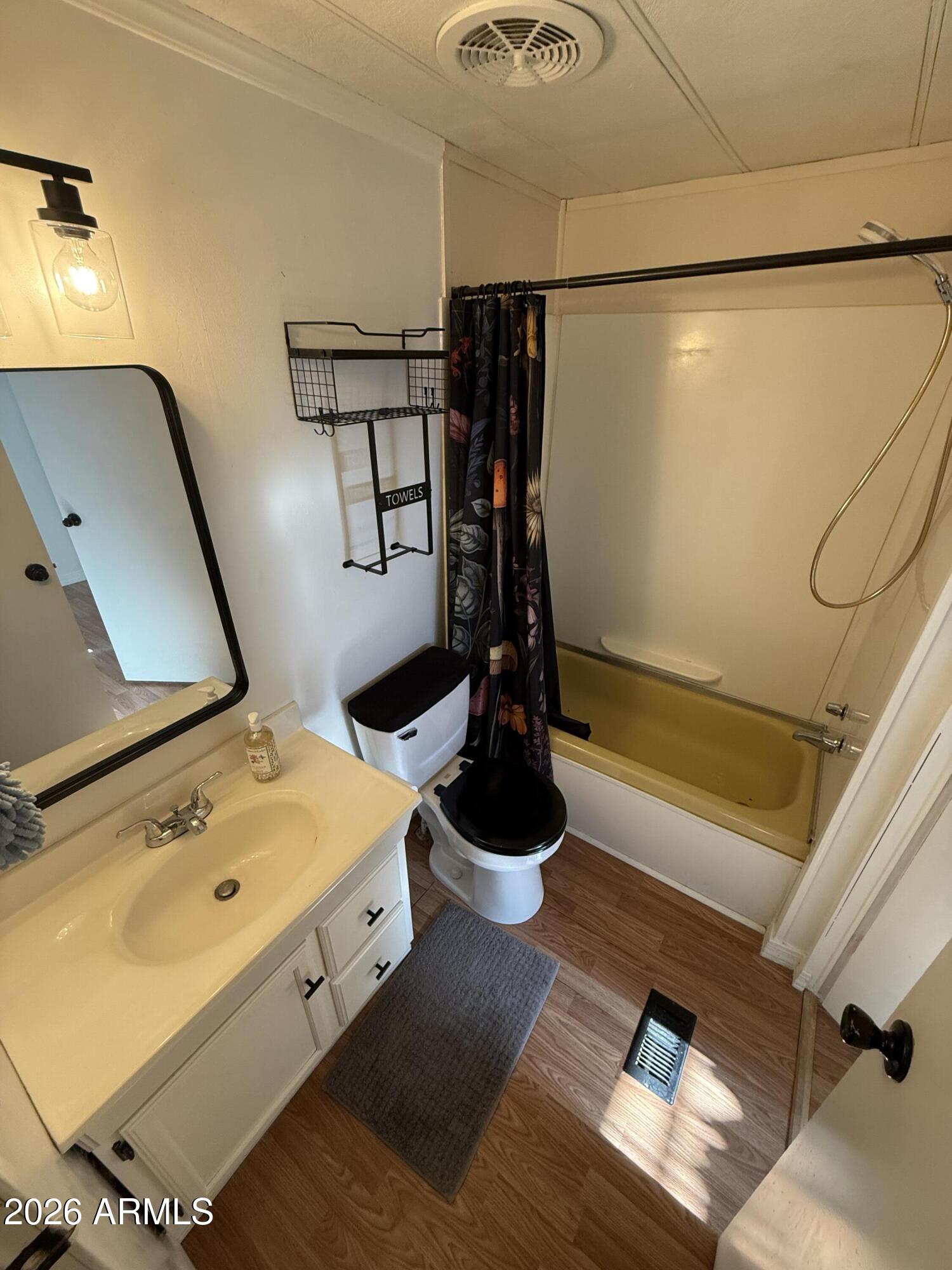 9501 East Broadway Road, Unit 48 Mesa, AZ 85208 - Photo 7 of 12 a bathroom with a sink and a mirror