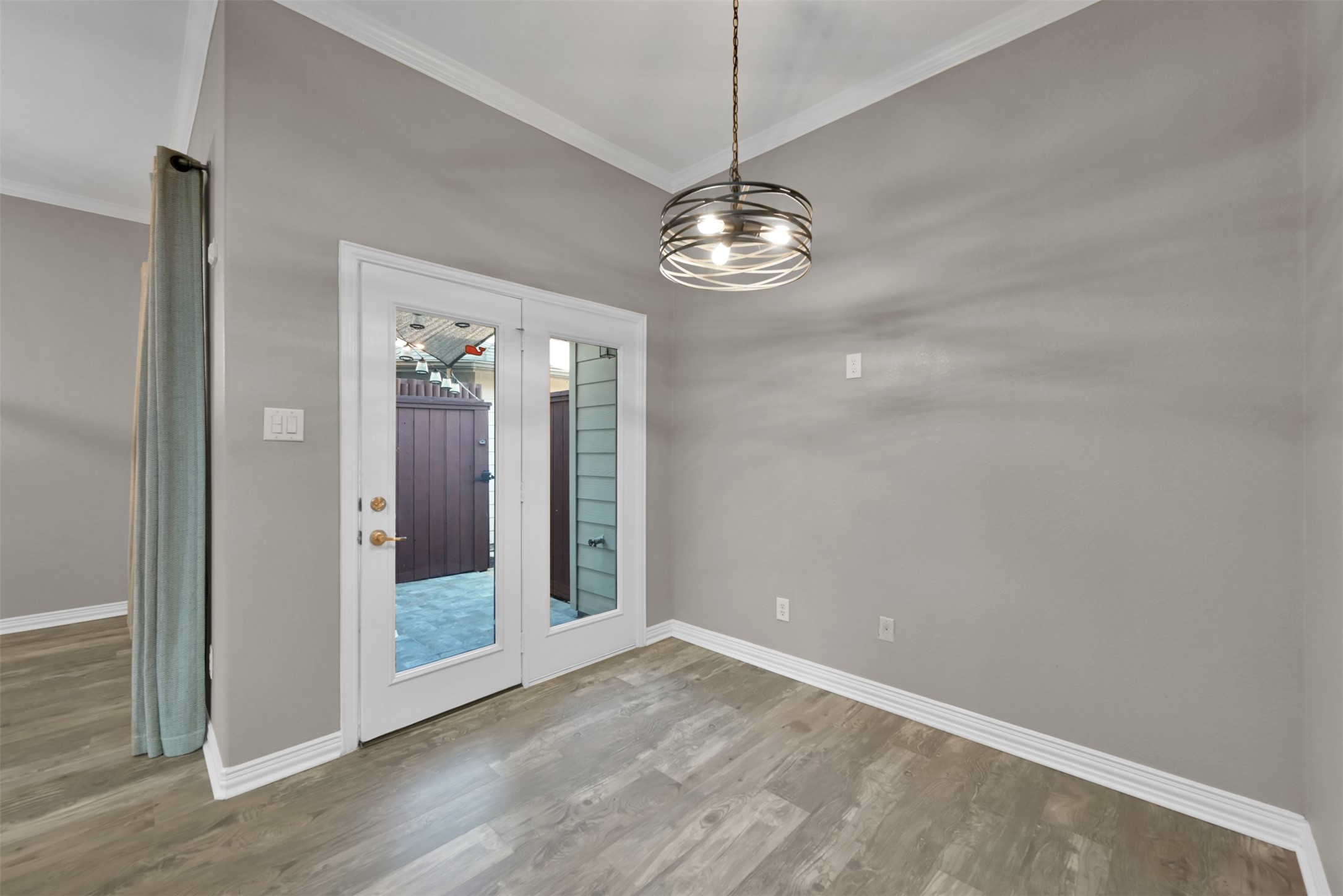 9222 Sunlight Oak Lane Houston, TX 77070 - Photo 11 of 29 a view of a chandelier in a room and wooden floor
