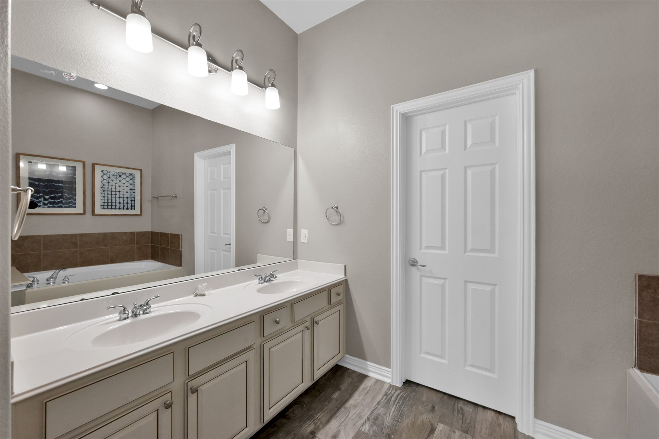 9222 Sunlight Oak Lane Houston, TX 77070 - Photo 14 of 29 a bathroom with a double vanity sink and mirror