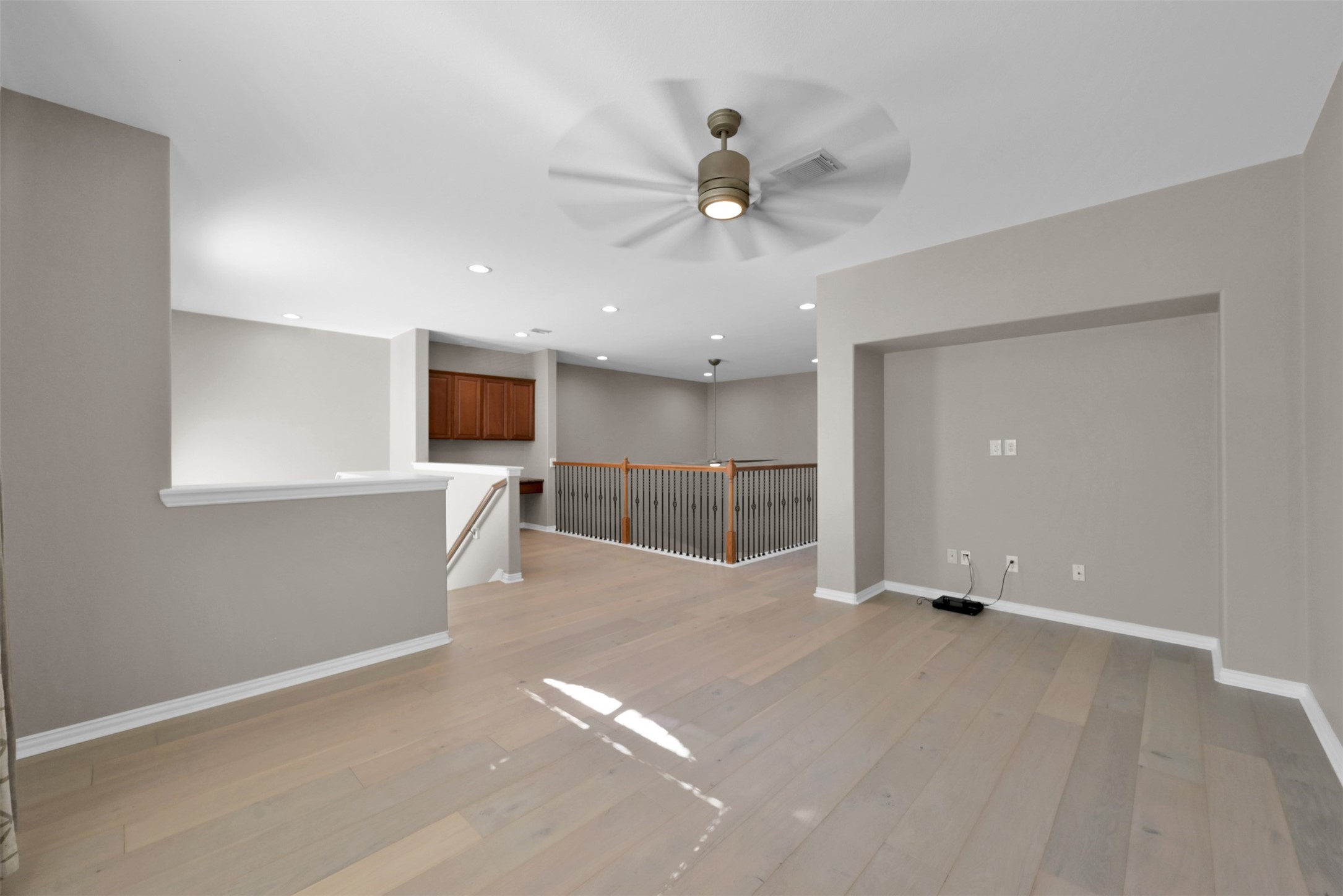 9222 Sunlight Oak Lane Houston, TX 77070 - Photo 21 of 29 a view of an empty room with a window and a kitchen