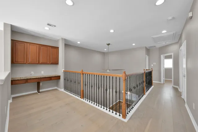 a view of a hallway with a dining table chair