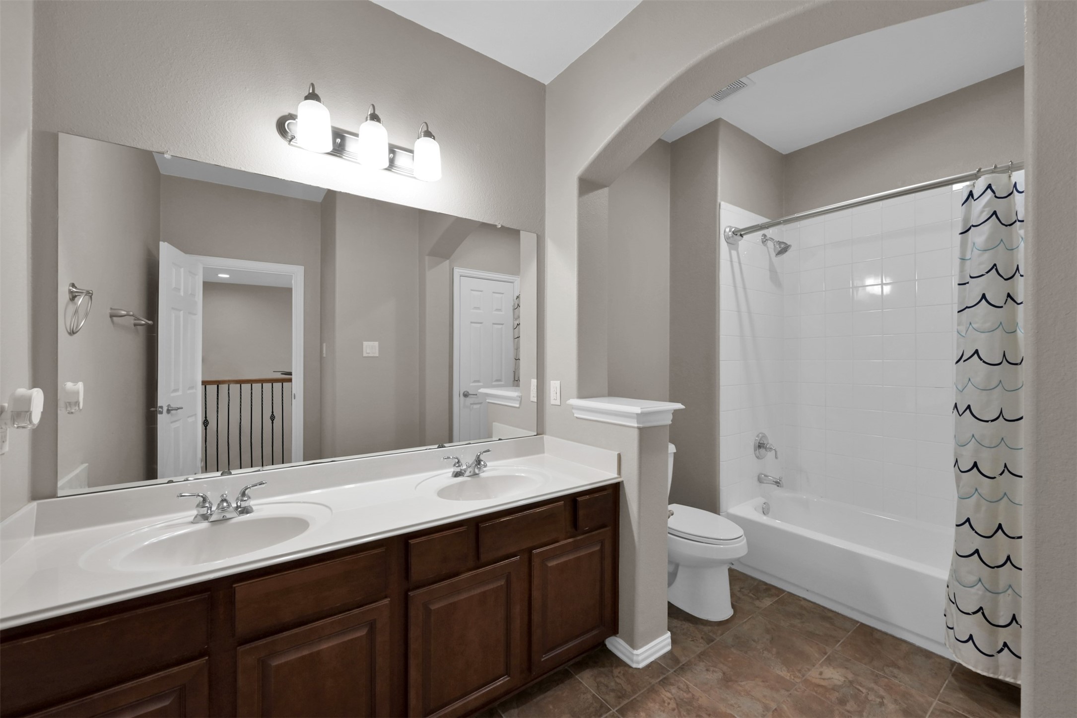 9222 Sunlight Oak Lane Houston, TX 77070 - Photo 24 of 29 a bathroom with a double vanity sink mirror double and bathtub