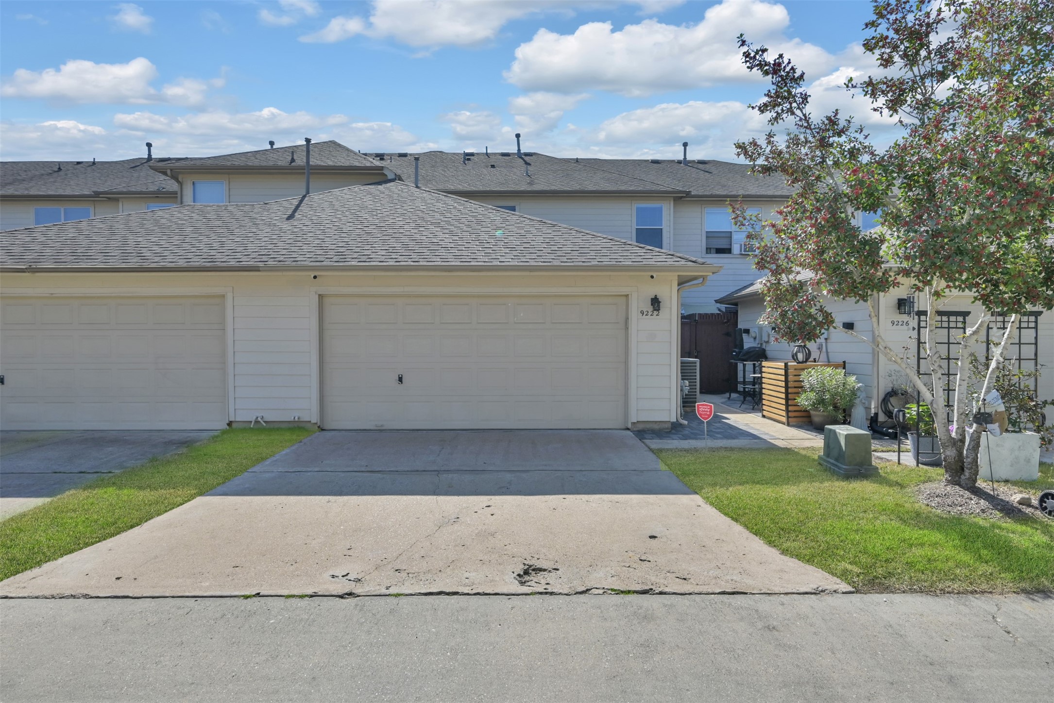 9222 Sunlight Oak Lane Houston, TX 77070 - Photo 27 of 29 a view of a white house with a yard