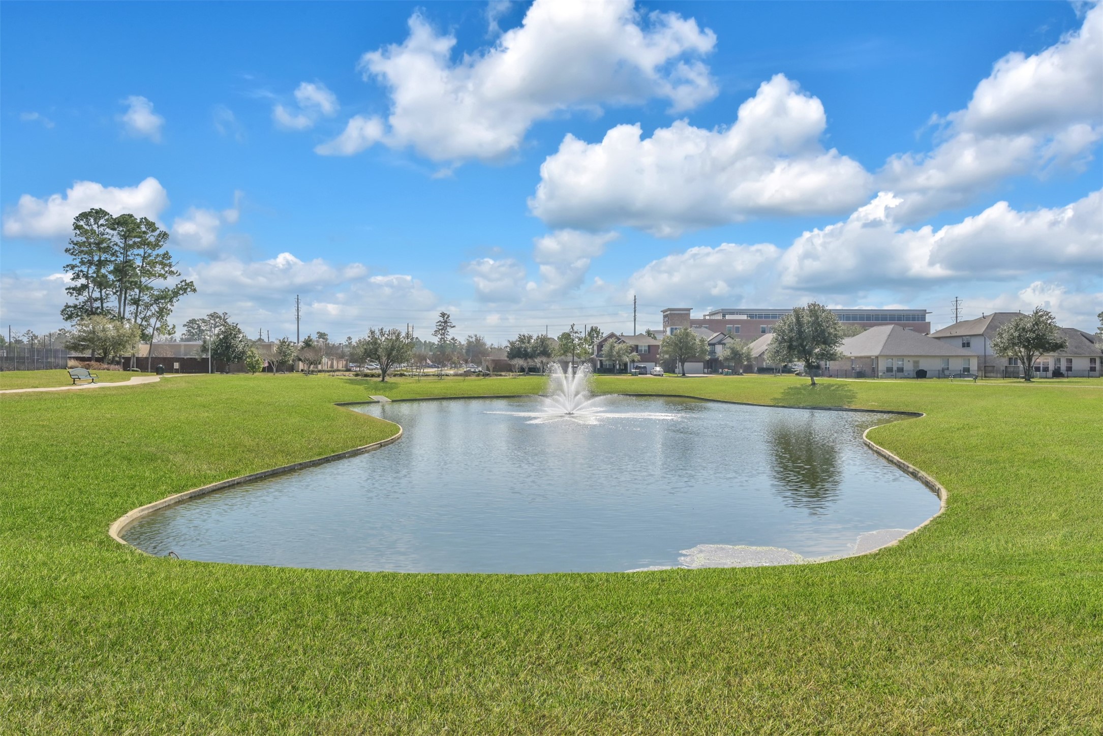 9222 Sunlight Oak Lane Houston, TX 77070 - Photo 28 of 29 a view of a lake with houses in the back
