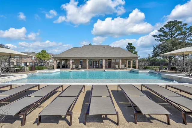 a view of house with swimming pool