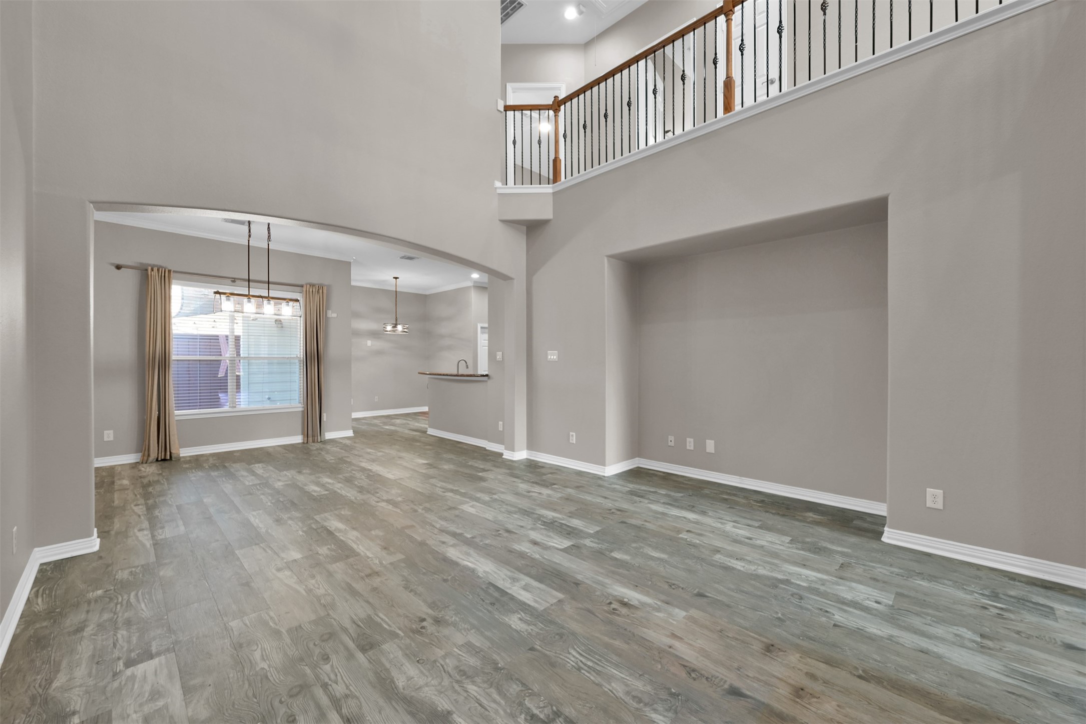 9222 Sunlight Oak Lane Houston, TX 77070 - Photo 7 of 29 a view of an empty room with wooden floor and a window