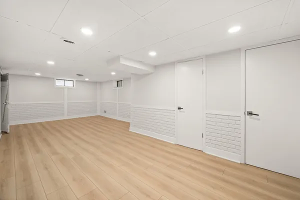 an empty room with wooden floor