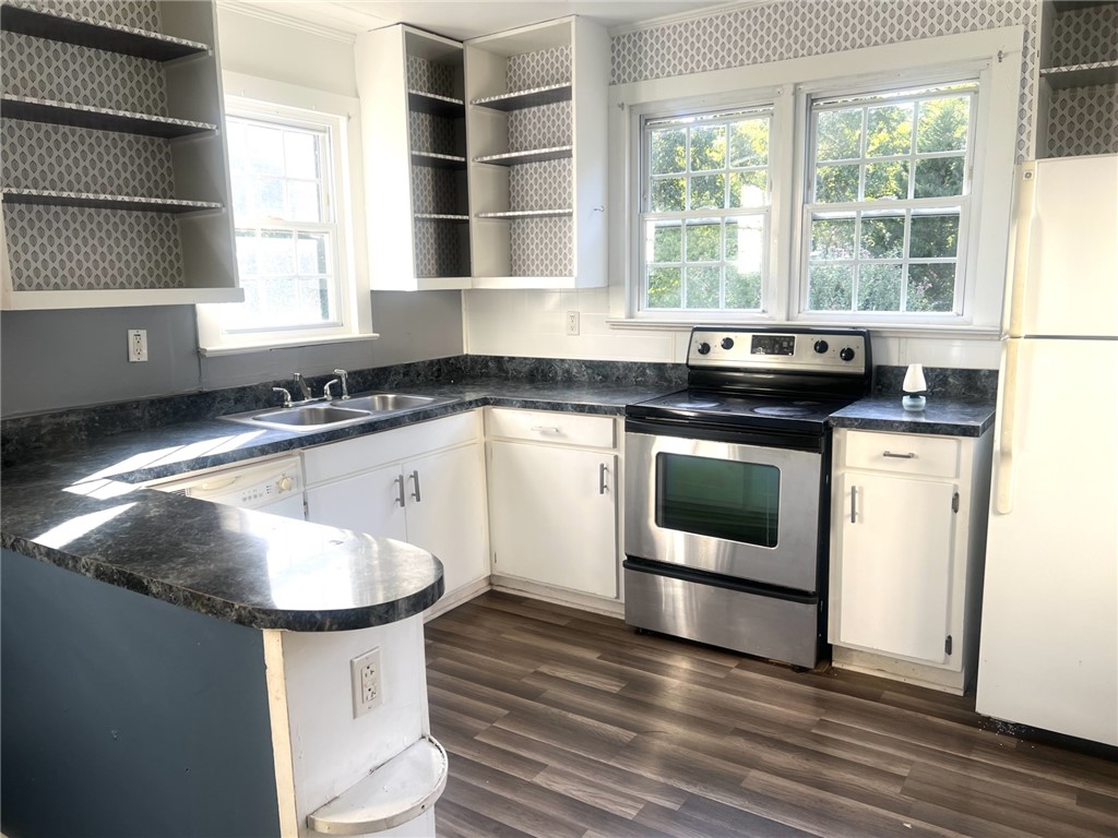 252 Friendship Road Seneca, SC 29678 - Photo 2 of 11 Natural light floods this kitchen featuring laminate flooring and classic open shelving.