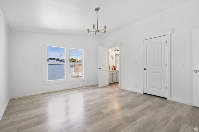 2600 North Hill Field Road, Unit 86 Layton, UT 84041 - Photo 10 of 25 Unfurnished dining area with hanging lights, light wood-type flooring, and lofted ceiling