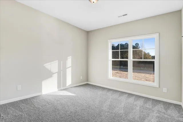a view of empty room with windows
