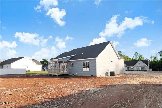 a view of house with yard