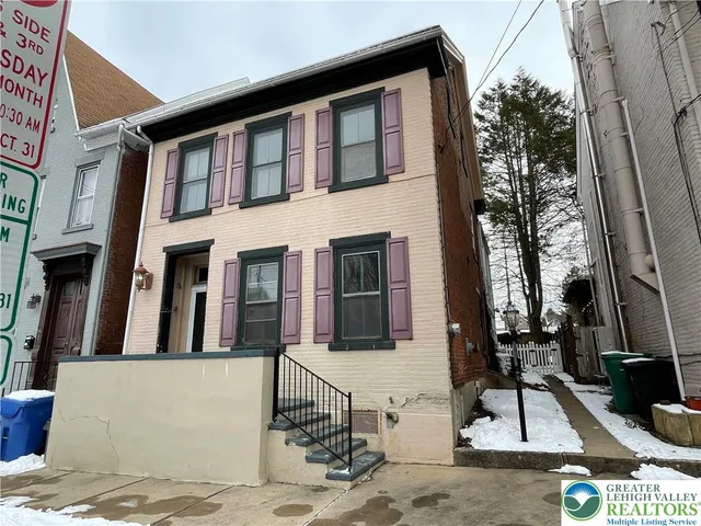 a front view of a house with garage