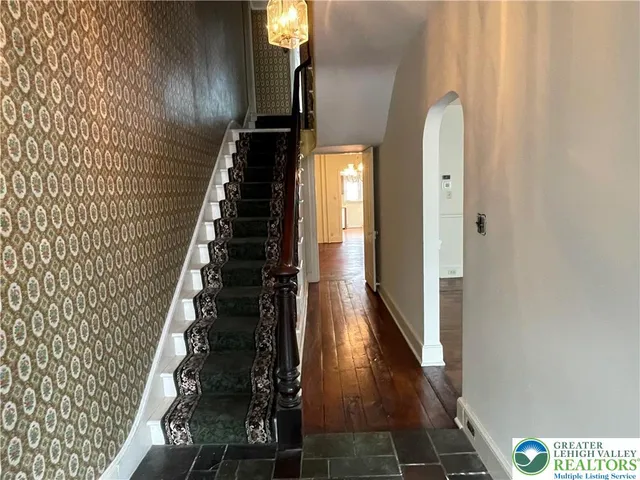 a view of entryway with wooden floor