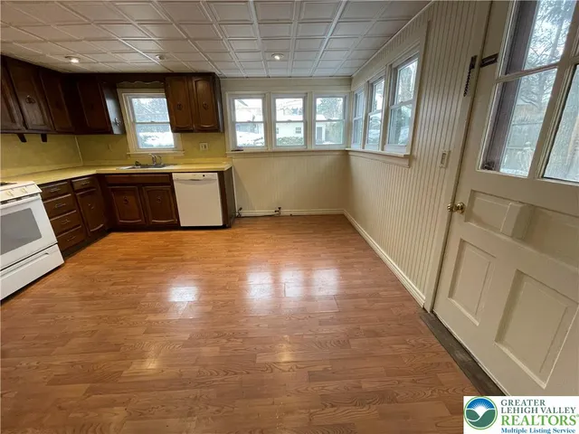 a view of a kitchen with a sink cabinets and a window