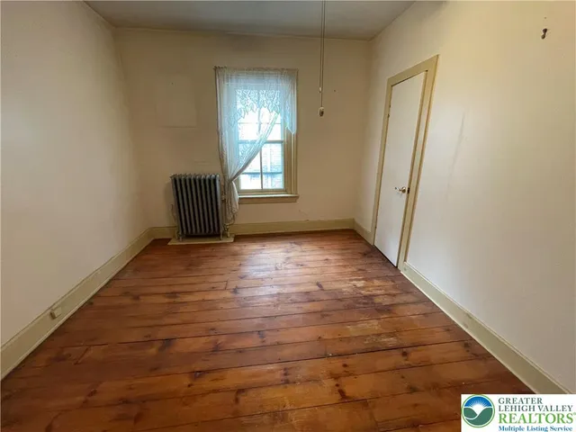 a view of an empty room and window