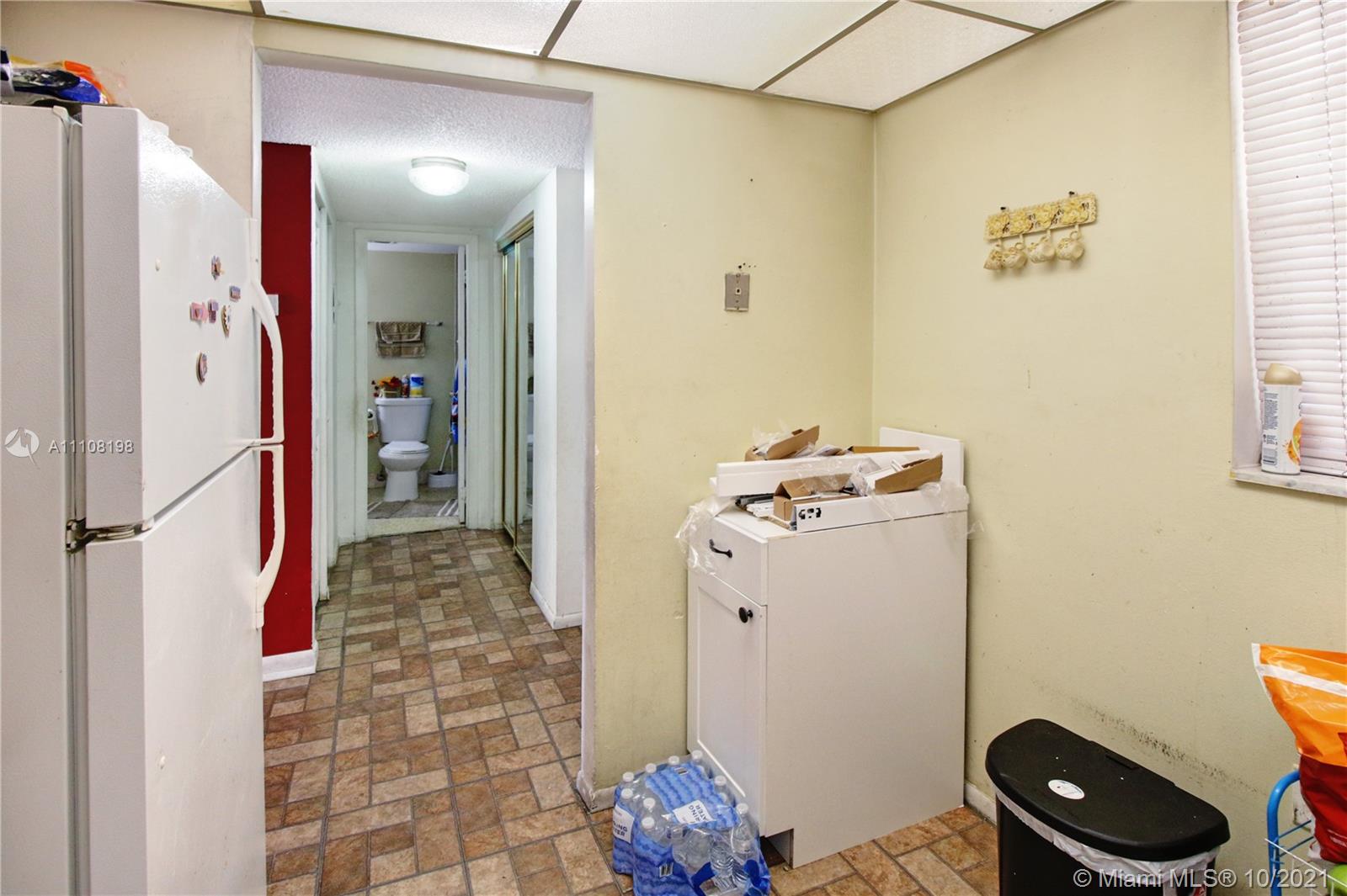 15600 Northwest 7th Avenue, Unit 3011 Miami, FL 33169 - Photo 11 of 30 a bathroom with a sink and a mirror