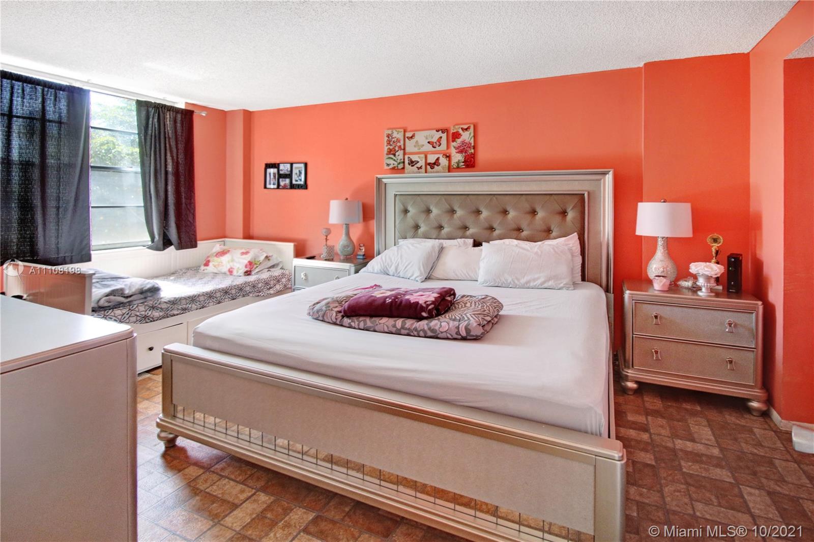 15600 Northwest 7th Avenue, Unit 3011 Miami, FL 33169 - Photo 12 of 30 a bedroom with a bed and a dresser