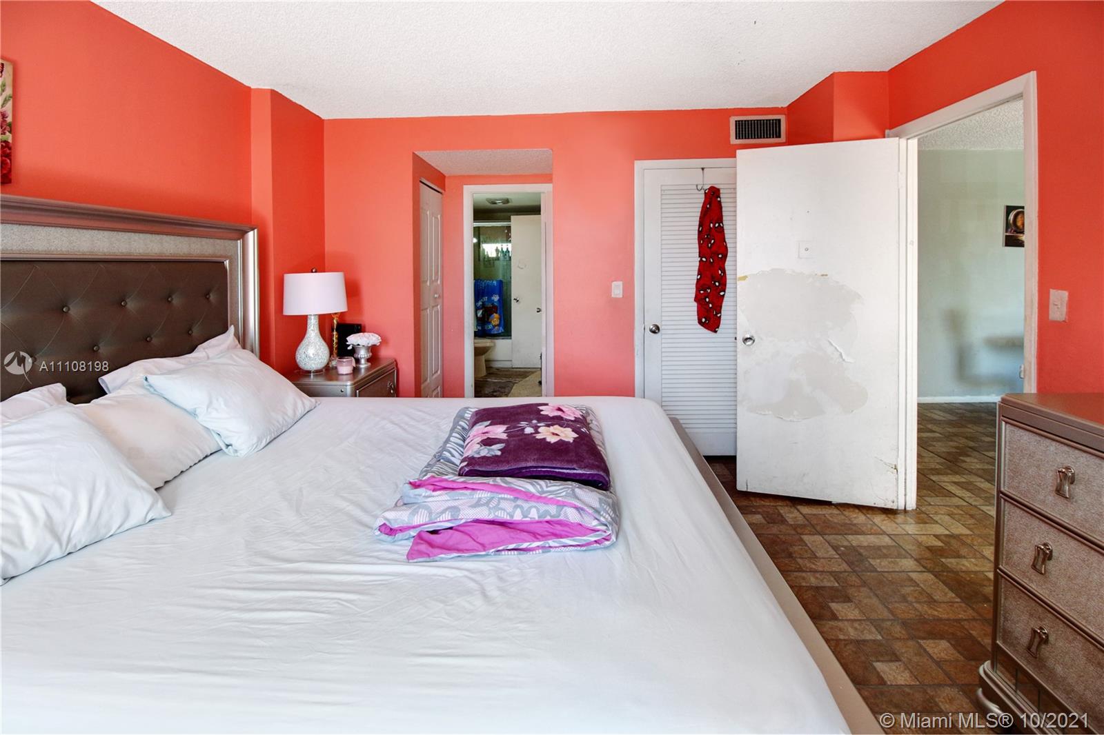 15600 Northwest 7th Avenue, Unit 3011 Miami, FL 33169 - Photo 16 of 30 a bedroom with a bed and a dresser