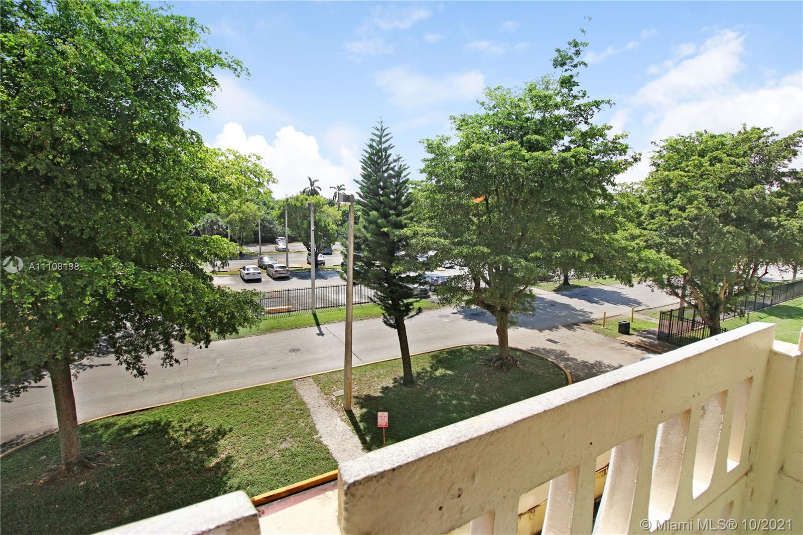 15600 Northwest 7th Avenue, Unit 3011 Miami, FL 33169 - Photo 21 of 30 a view of a yard with potted plants