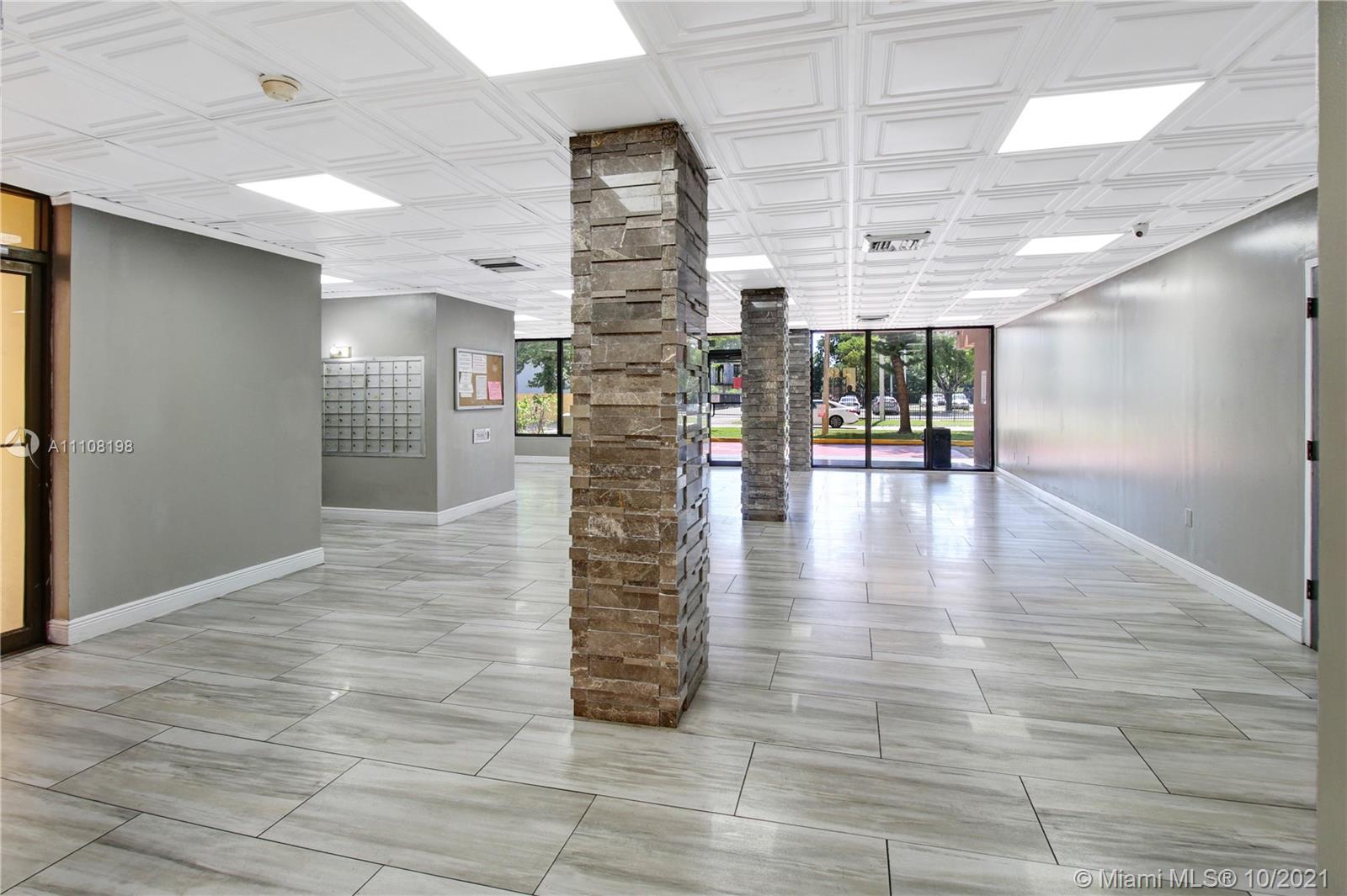 15600 Northwest 7th Avenue, Unit 3011 Miami, FL 33169 - Photo 26 of 30 a view of livingroom with an empty space and wooden floor