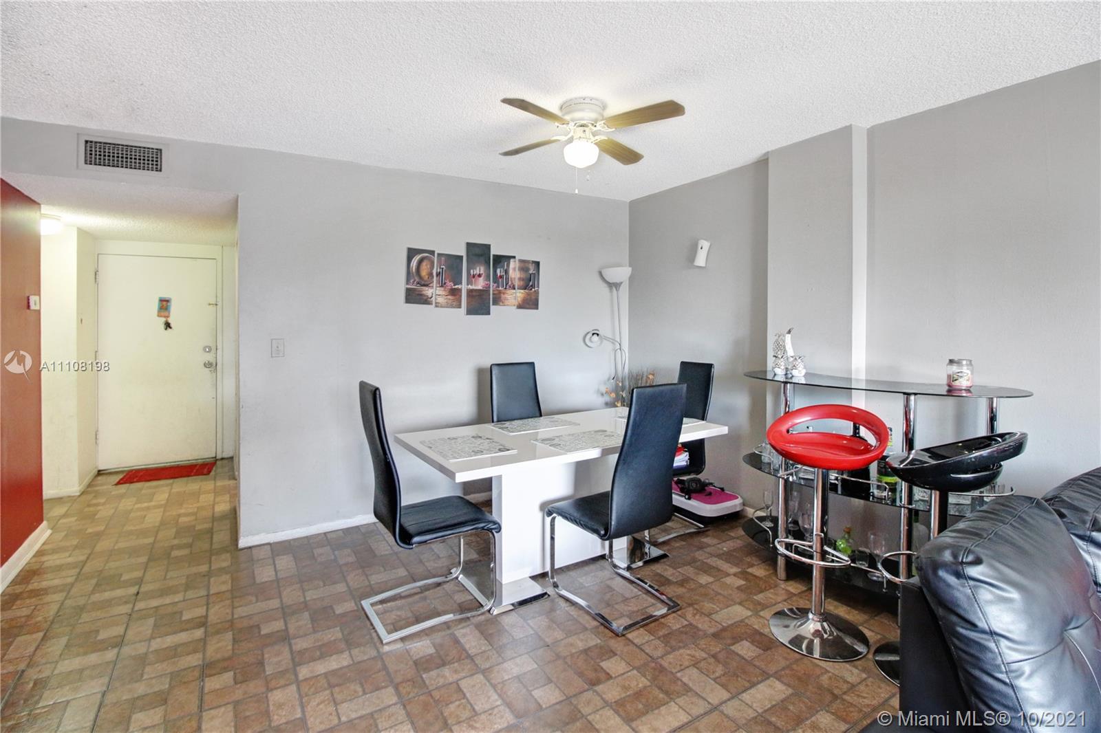 15600 Northwest 7th Avenue, Unit 3011 Miami, FL 33169 - Photo 8 of 30 a view of a dining room with furniture