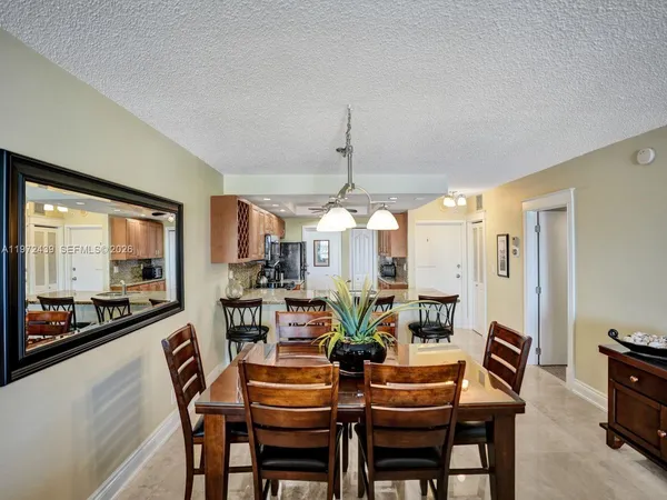 a dining room with furniture and window