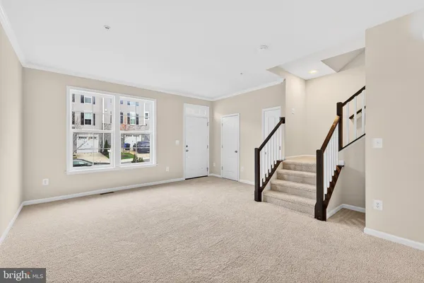 a view of an empty room with stairs