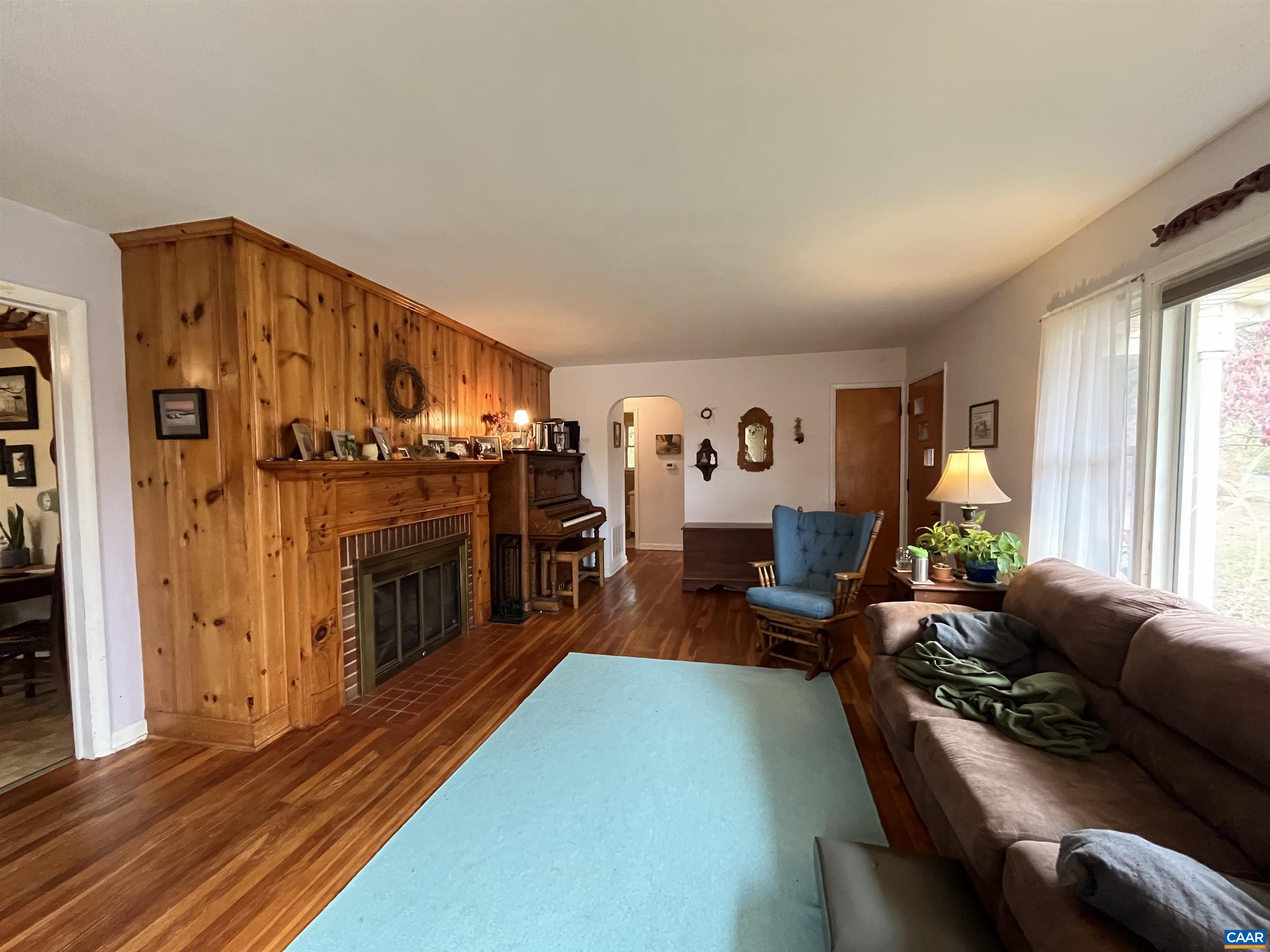 1839 Afton Mountain Road Afton, VA 22920 - Photo 4 of 11 a living room with furniture and a fireplace