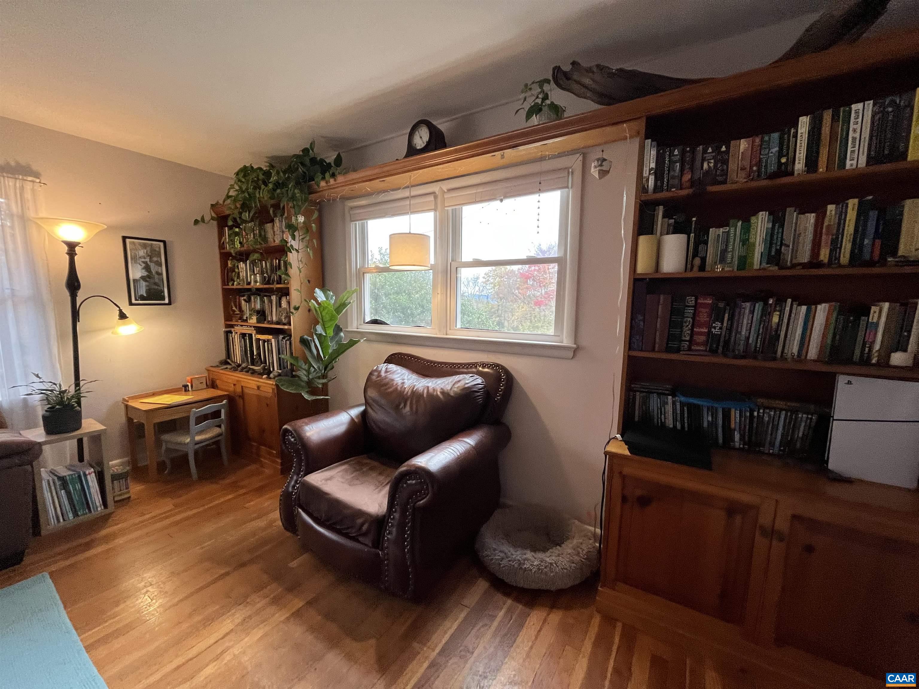 1839 Afton Mountain Road Afton, VA 22920 - Photo 5 of 11 a living room with furniture and a book shelf