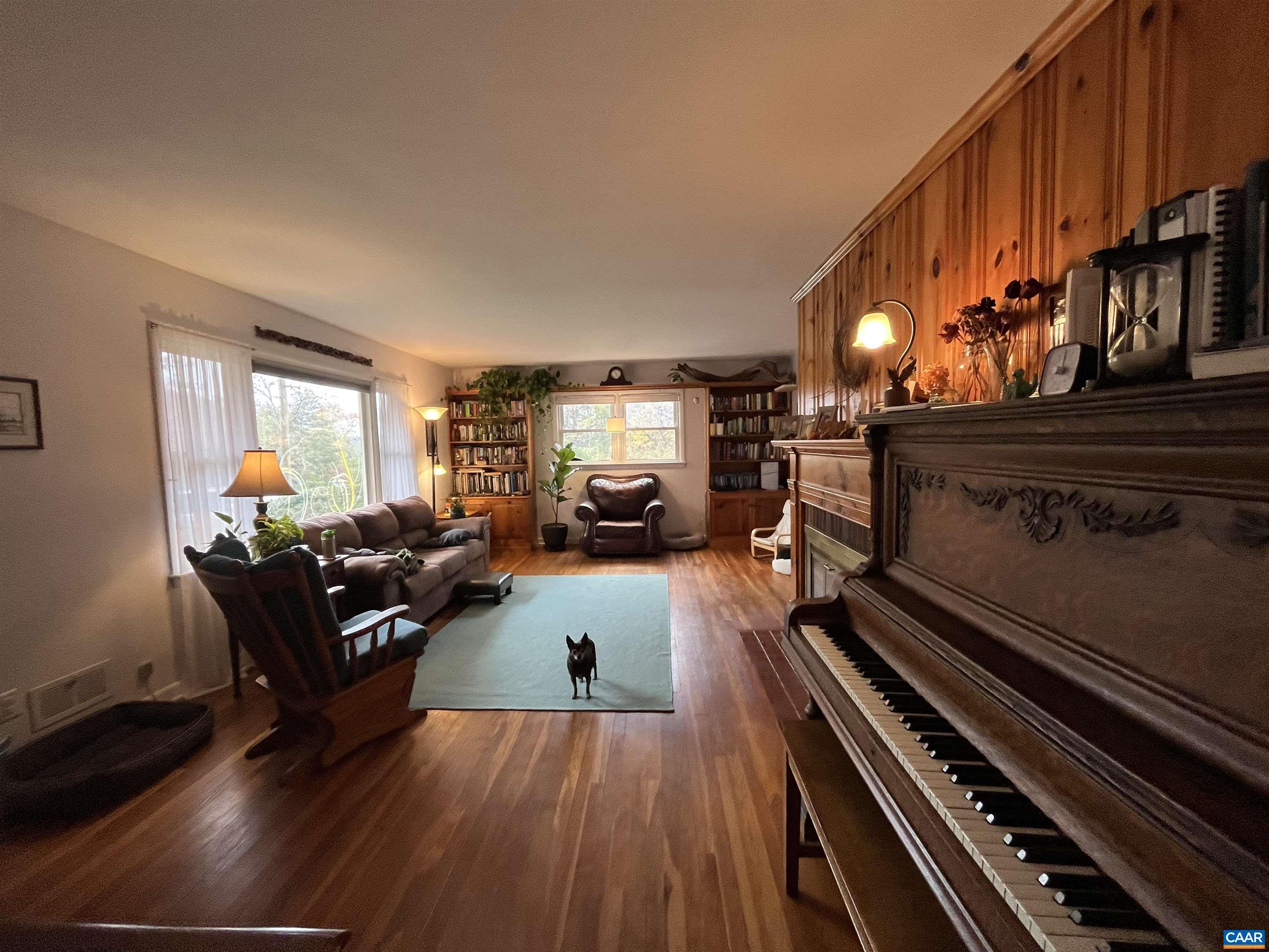 1839 Afton Mountain Road Afton, VA 22920 - Photo 6 of 11 a living room with furniture and a fireplace