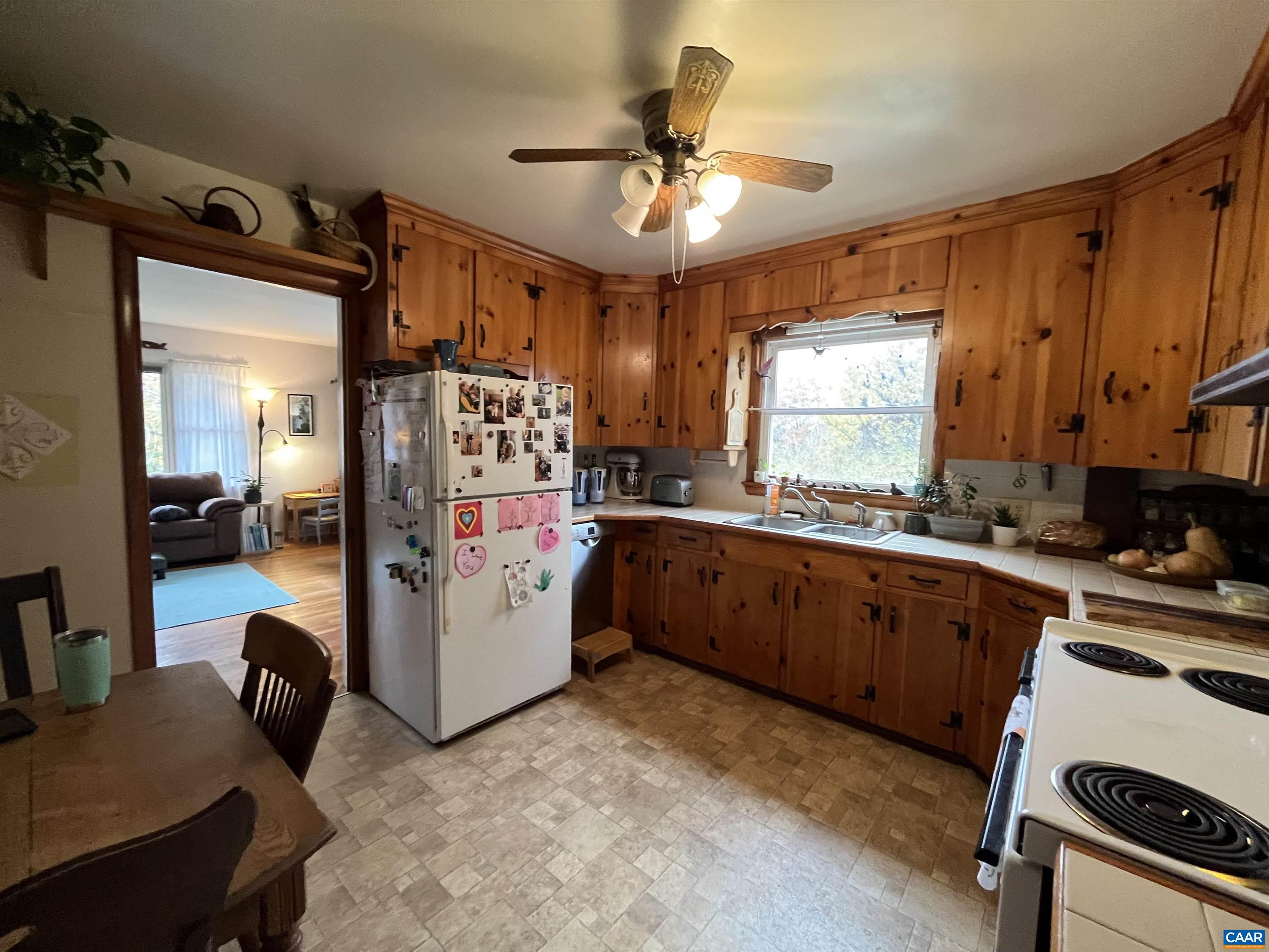 1839 Afton Mountain Road Afton, VA 22920 - Photo 7 of 11 a kitchen with refrigerator cabinets and furniture