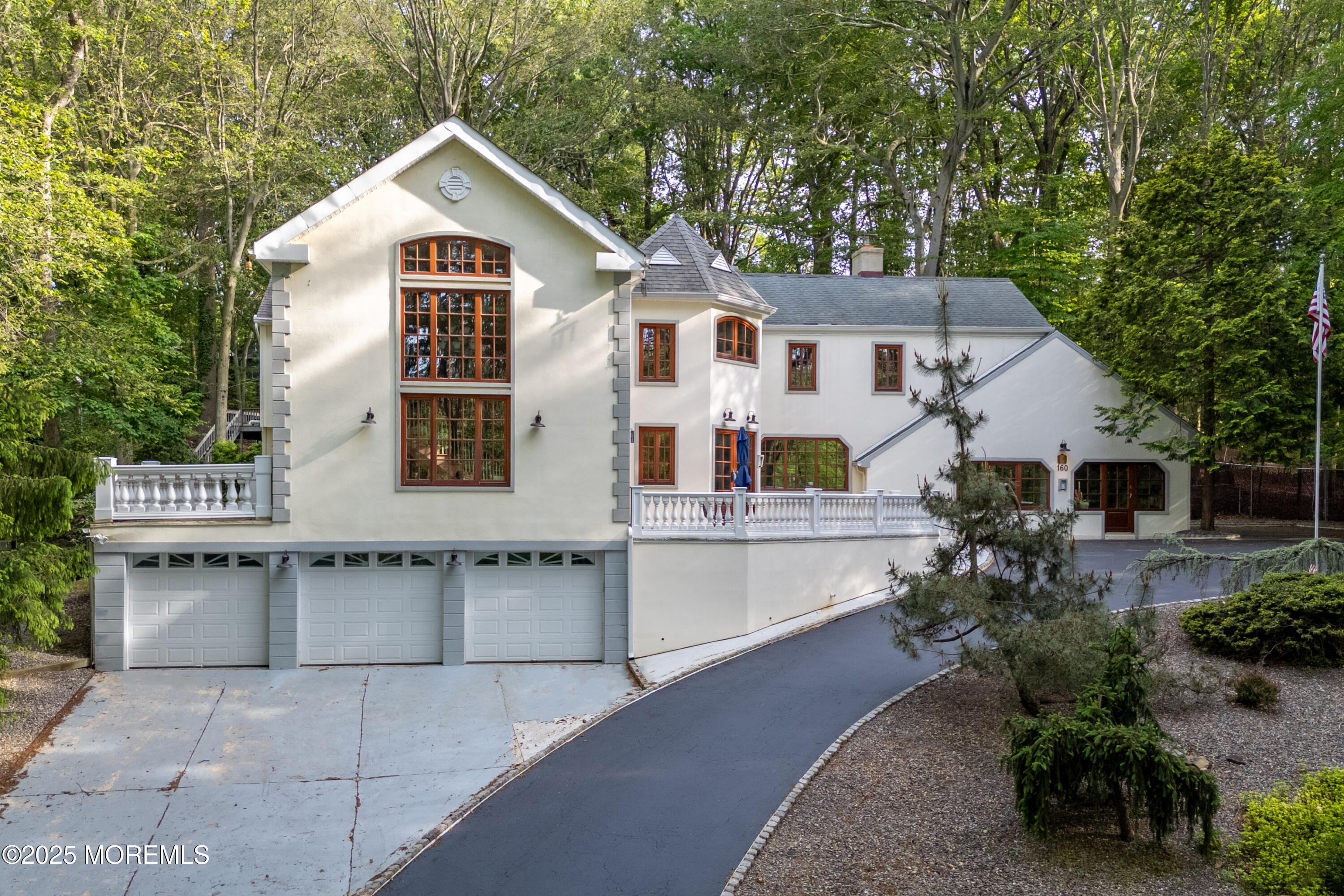 160 Pelican Road Middletown, NJ 07748 - Photo 3 of 65 a view of a white house with large windows and a table and chairs