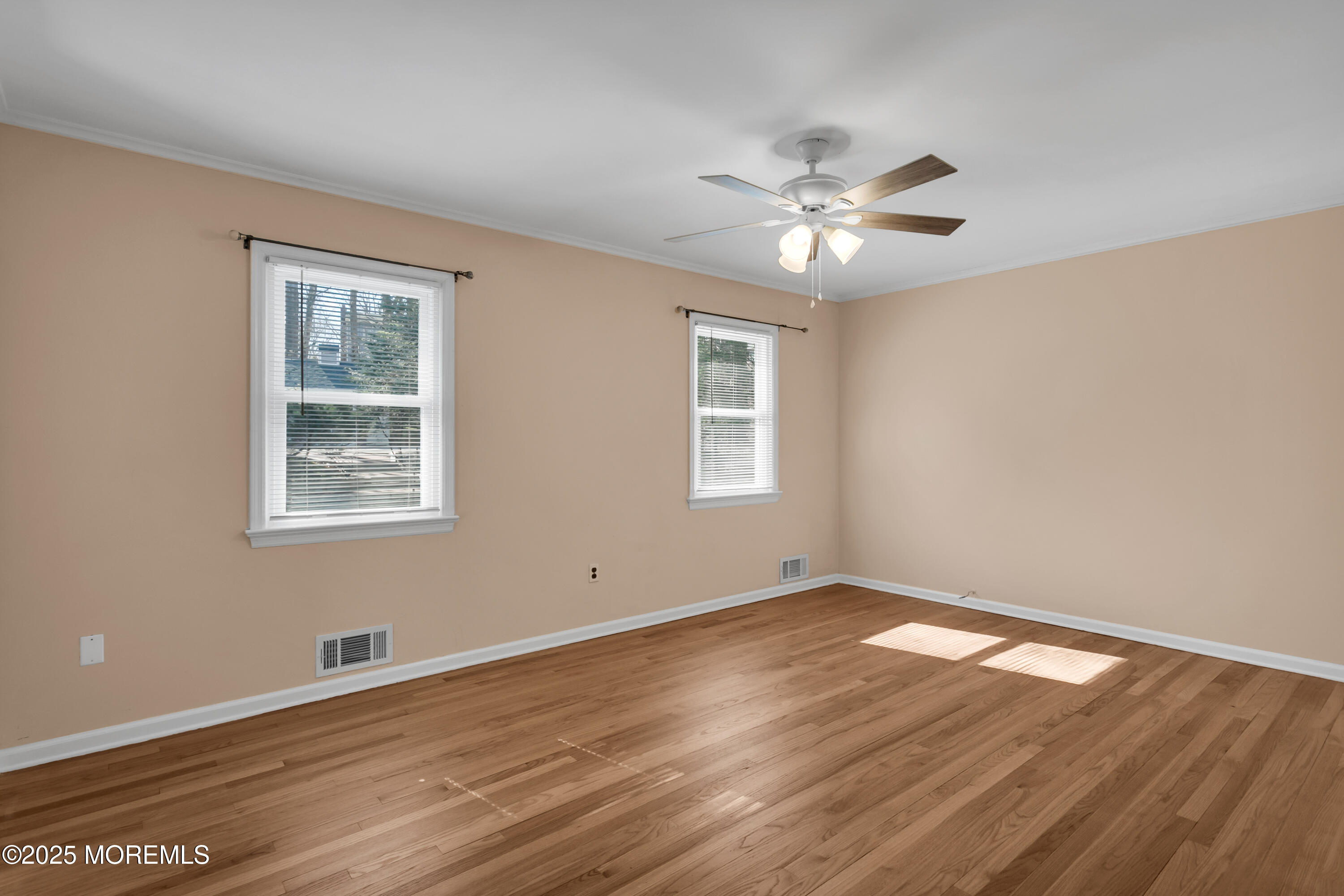 160 Pelican Road Middletown, NJ 07748 - Photo 31 of 65 a view of an empty room with wooden floor and a window