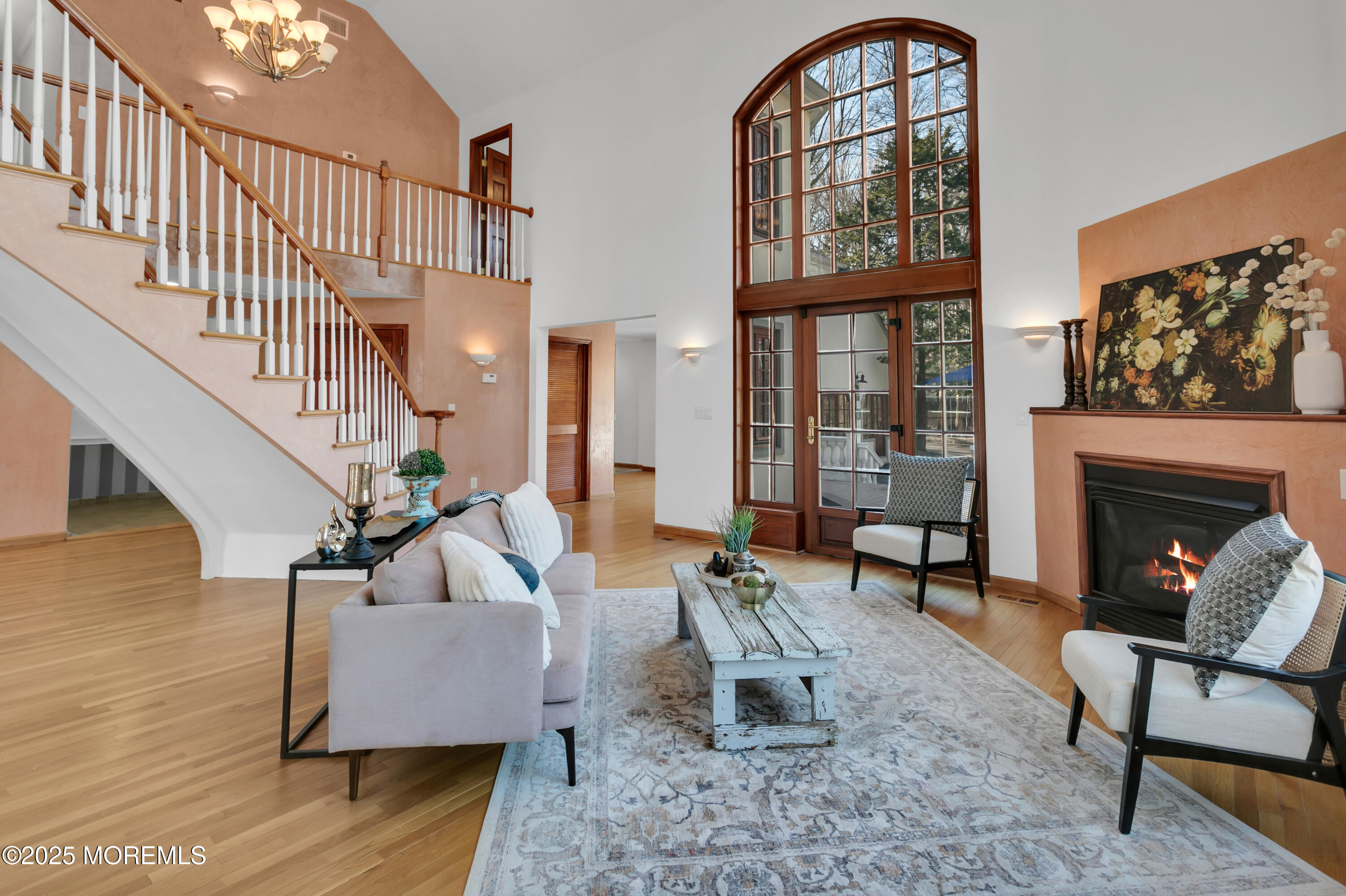 160 Pelican Road Middletown, NJ 07748 - Photo 8 of 65 a living room with furniture a rug and a fireplace