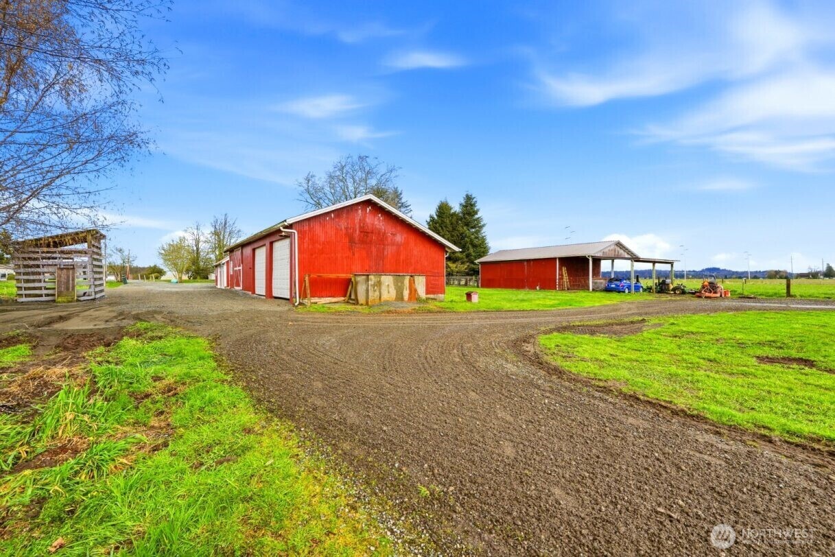 19500 Dahlstedt Road Burlington, WA 98233 - Photo 27 of 39 a view of green field with house in the background