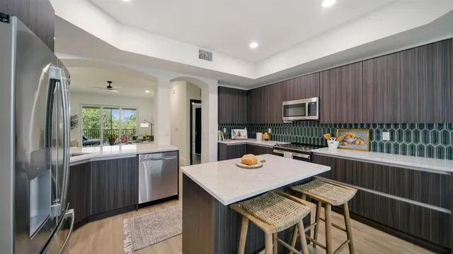 a kitchen with a table and chairs in it