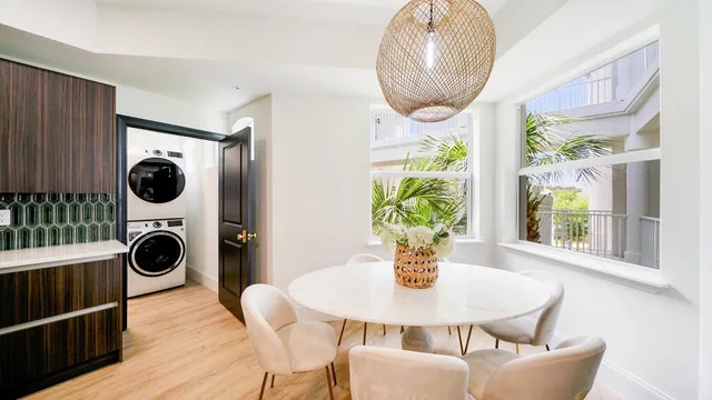 a view of a dining room with furniture window and wooden floor